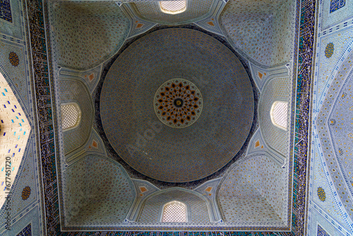 Ornament of the dome and interior of the Bibi Hanum mosque in Samarkand, Uzbekistan. Muslim oriental traditional geometric ornament. photo