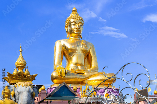 beautiful Wat Buddhist temples in Chiangmai Chiang mai Thailand. Decorated in beautiful ornate colours of red and Gold and Blue. Lovely sunset