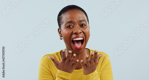 Excited black woman, portrait and face in surprise for winning, prize or celebration against a studio background. Happy African female person in wow, shock or bonus promotion on sale discount or deal