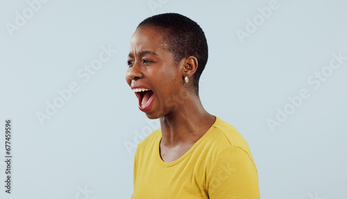 Anxiety, stress and angry black woman screaming in studio with broken heart, grief or fear on grey background. Psychology, depression and African female model shouting with trauma, conflict or crisis