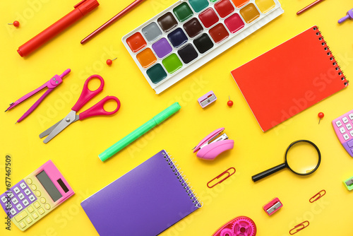 Composition with different school supplies on yellow background