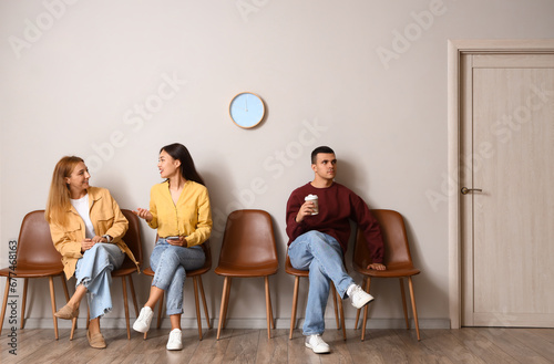 People waiting for their tu...