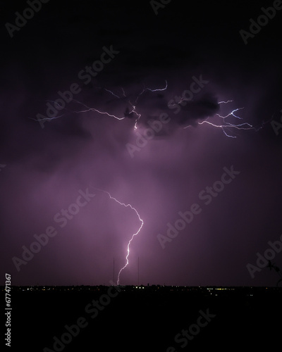 Strike of Lightning in the Purple Night Stormy Sky