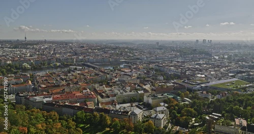 Prague Czechia Aerial v41 cinematic flyover Petrin hill capturing cityscape of Smichov and views of New town and downtown across Vltava river on a sunny day - Shot with Mavic 3 Cine - November 2022 photo