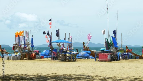 Wallpaper Mural A fishing area in Pattaya where fishermen gather with their fishing boats, nets, and other equipment like ice boxes, tables, and chairs for sorting their catch for the day, in Chonburi, Thailand. Torontodigital.ca