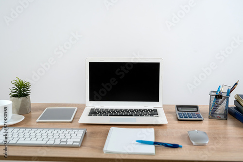 Desk for study work or freelance with note pad pen and laptop