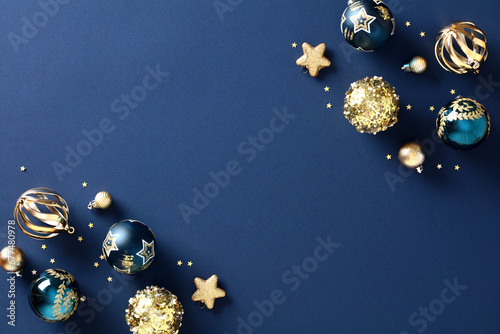 Christmas elegant navy blue background adorned with festive baubles, golden stars, and stylish ornaments. Chic and classic design, featuring a touch of vintage charm, is perfect for creating a luxurio photo