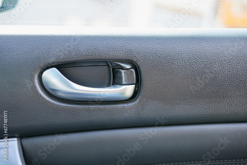 Car door handle with car door lock. Interior of modern car. © Vin.rusanov