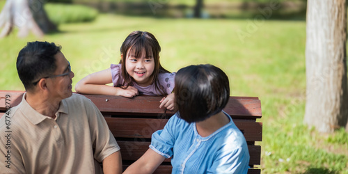 Grandparent playing togetherness with a granddaughter in the park in the morning. Family, love and grandchild bonding with grandfather and grandma in a park. concept child and senior