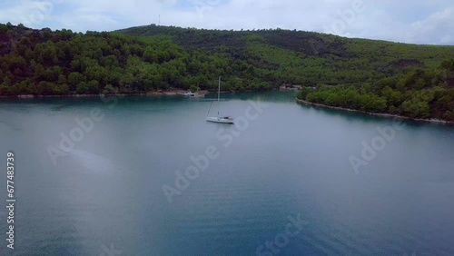 Elegant sailboat on croatian peaceful waters between islands