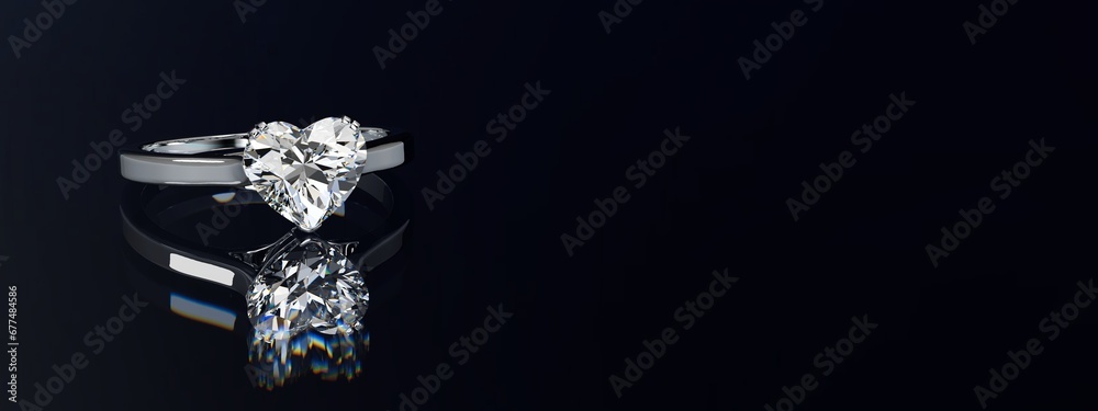 Heart cut diamond ring on black glossy background. Wide image.