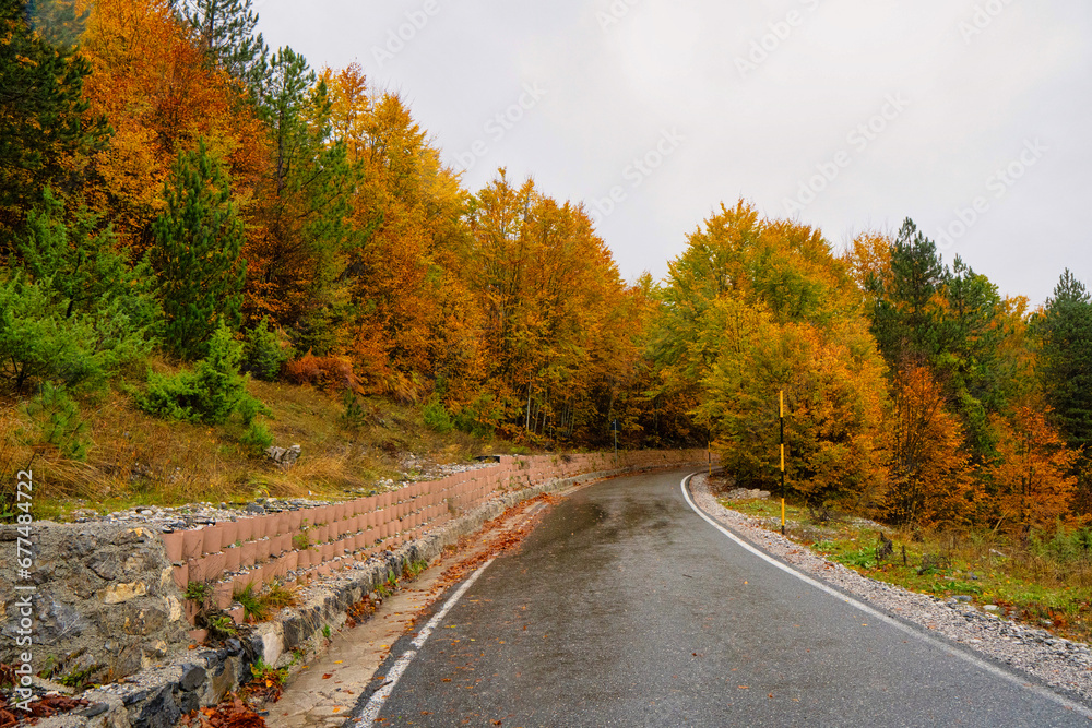Obraz premium Mountain Road through Thethi National Park in northern Albania showing the magnificent colors of Autumn. 
