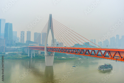 View of Chongqing , Yangtze River and Qiansimen Bridge during evening at Chongqing Yuzhong District , China : 24 October 2023 photo