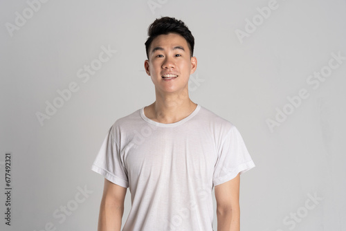 Portrait of Asian man posing on white background © 1112000