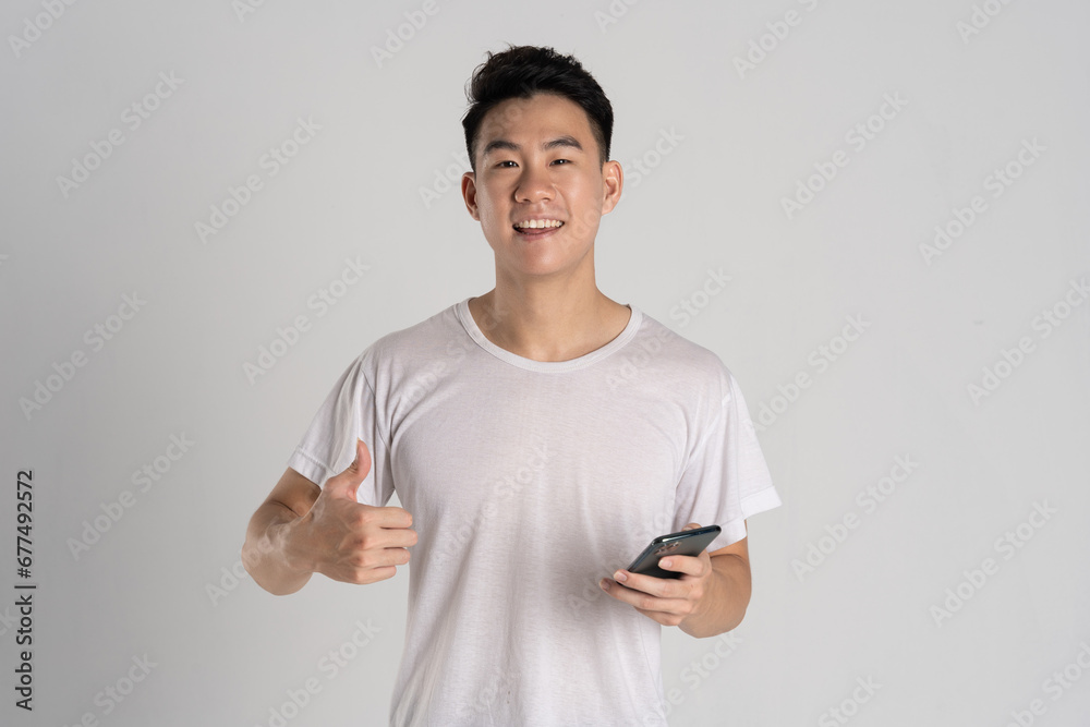Portrait of Asian man posing on white background Portrait of Asian man posing on white background