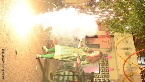 Woman enjoying with lights fireworks. Diwali fireworks, Festival of lights. Deepawali festival. Hindu holidays. Seasonal. Firecrackers lights.