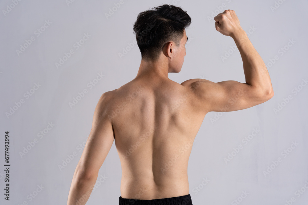 Image of Asian male athlete with good physique on white background Image of Asian male athlete with good physique on white background