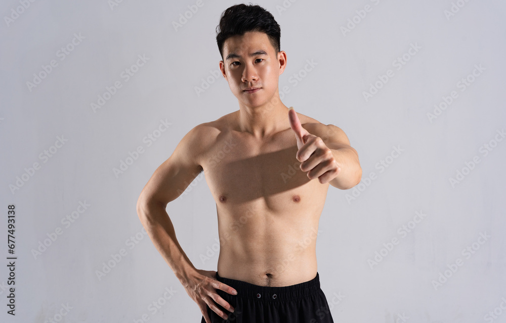 Image of Asian male athlete with good physique on white background