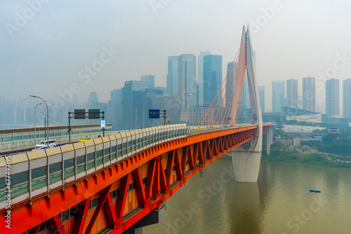 View of Chongqing , Yangtze River and Qiansimen Bridge during evening at Chongqing Yuzhong District , China : 24 October 2023 photo