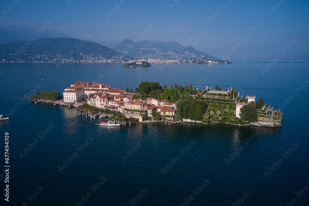 Panorama at sunset on Lake Maggiore top view. Aerial view of Isola Bella drone panoramic view. Borromean Islands, Lake Maggiore, Piedmont, Europe. Lake Maggiore, island, Isola Bella, Italy.