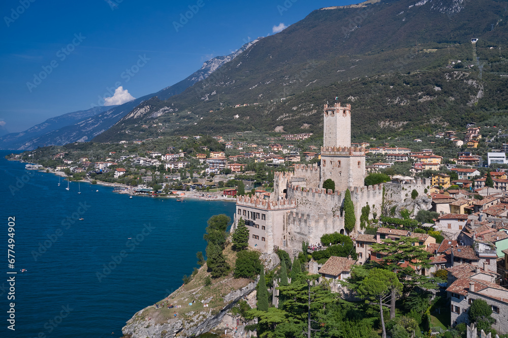 Malcesine is a small town on the shore of Lake Garda in Verona province, Italy. Town of Malcesine on Lago di Garda skyline view, Veneto region of Italy.