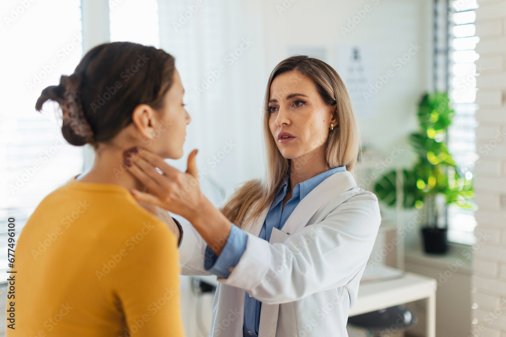 Doctor examining lymp nodes on neck of the teenage girl. Palpation of lymph nodes. Concept of preventive health care for adolescents. Doctor examining lymp nodes on neck of the teenage girl. Palpation of lymph nodes. Concept of preventive health care for adolescents.