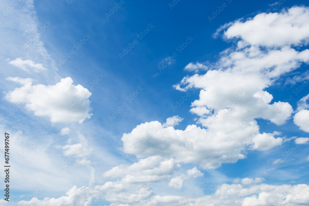 Obraz premium Cumulus clouds in blue sky, white fluffy clouds floating in blue sky, blue sky background with clouds