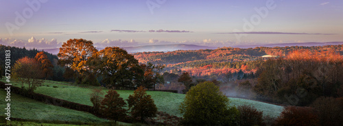 Autumn dawn over the high weald to the south downs near Penhurst east Sussex south east England UK