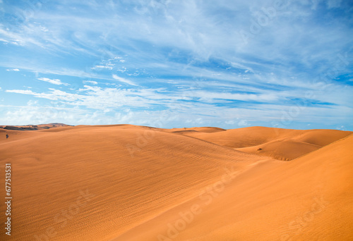 A tranquil azure sky over an arid desert landscape.