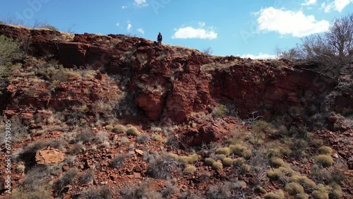 Aerial Video of Person Standing on Rock Formation in Karijini National Park, Pilbara, Western Australia photo