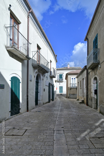 Fototapeta Naklejka Na Ścianę i Meble -  A narrow street among the old houses of Frigento, a town in Campania in Italy.