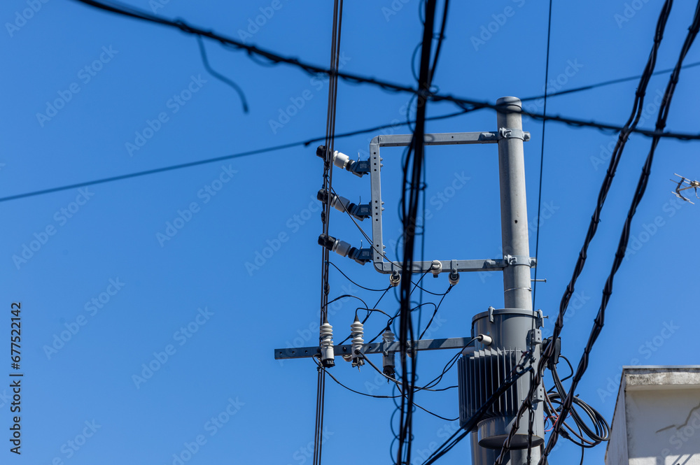 A lot of electric wires on a pole, electricity transmission in Japan A lot of electric wires on a pole, electricity transmission in Japan
