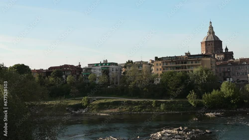Nice covered bridge and Duomo di Pavia (Pavia Cathedral) in Pavia at sunny day shot at 30 fps Nice covered bridge and Duomo di Pavia (Pavia Cathedral) in Pavia at sunny day shot at 30 fps