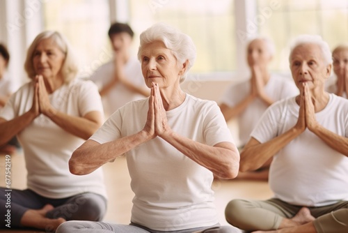 The elderly people in the house were eager to stand and do yoga together. The concept of active aging photo