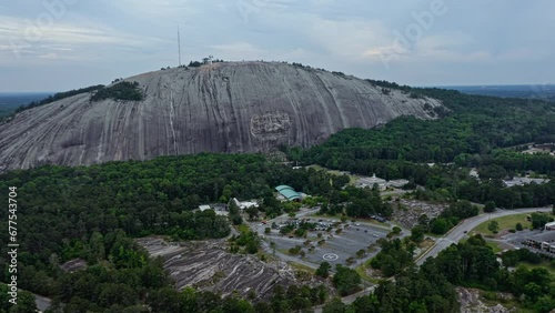 Aerial approaching shot of Granitic rock in Stone Mountain, Georgia, America photo