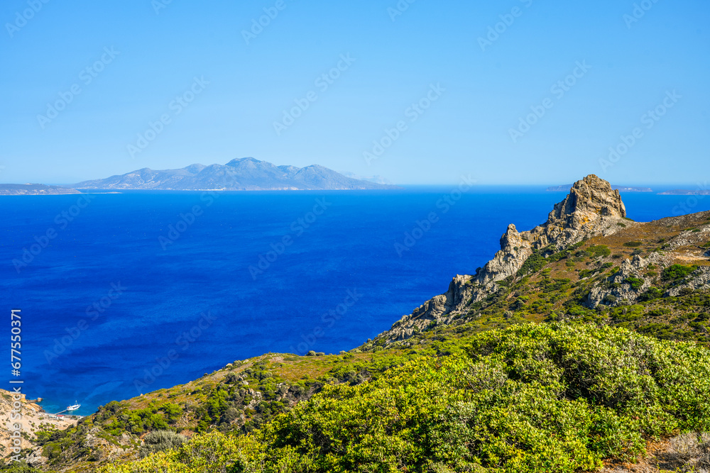 View of the landscape and the Mediterranean Sea from a mountain on the Greek island of Kos.	