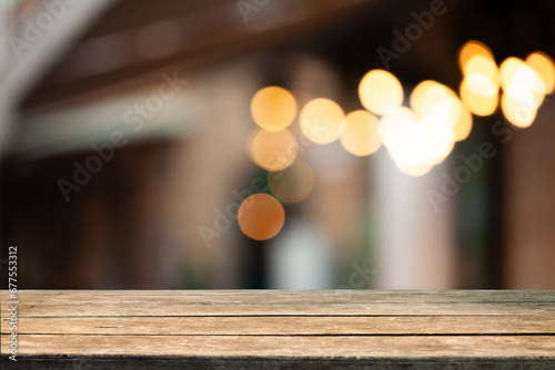 blurred background of bar and dark brown retro wooden table for product