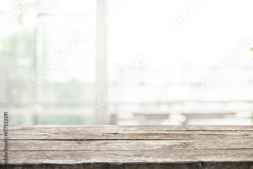 empty wooden table on background of abstract blur white interior  montage  product display  inside and window.