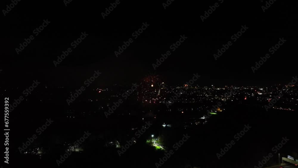 Aerial shot of tiered fireworks exploding at a organised display in Scotland