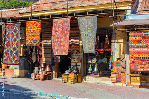 Bergama carpets. Antique shop at the street of Bergama. Travelling and shopping, traditional handmade souvenirs. Bergama, Turkey (Turkiye)