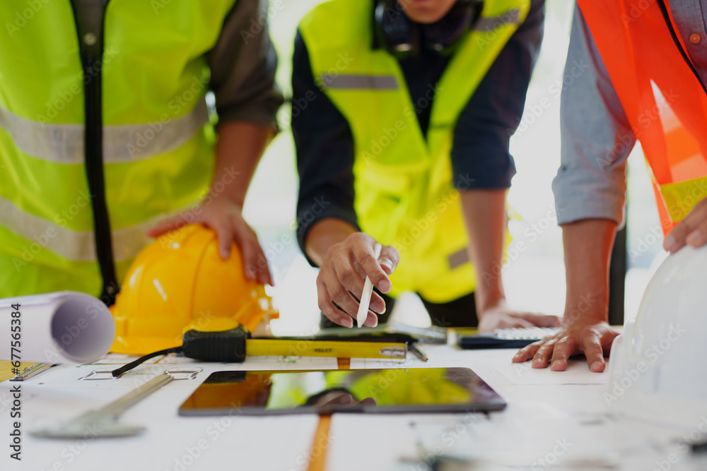 Engineers, designers and interior designers are finalizing the design of interiors by discussing selecting materials and colors to design rooms to present to clients. Engineers, designers and interior designers are finalizing the design of interiors by discussing selecting materials and colors to design rooms to present to clients.