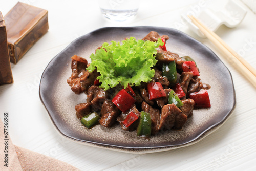 traditional chinese stir fried beef wagyu black pepper spicy sauce meat main course in plate on grey vintage background cafe hotel luxury halal food restaurant banquet menu