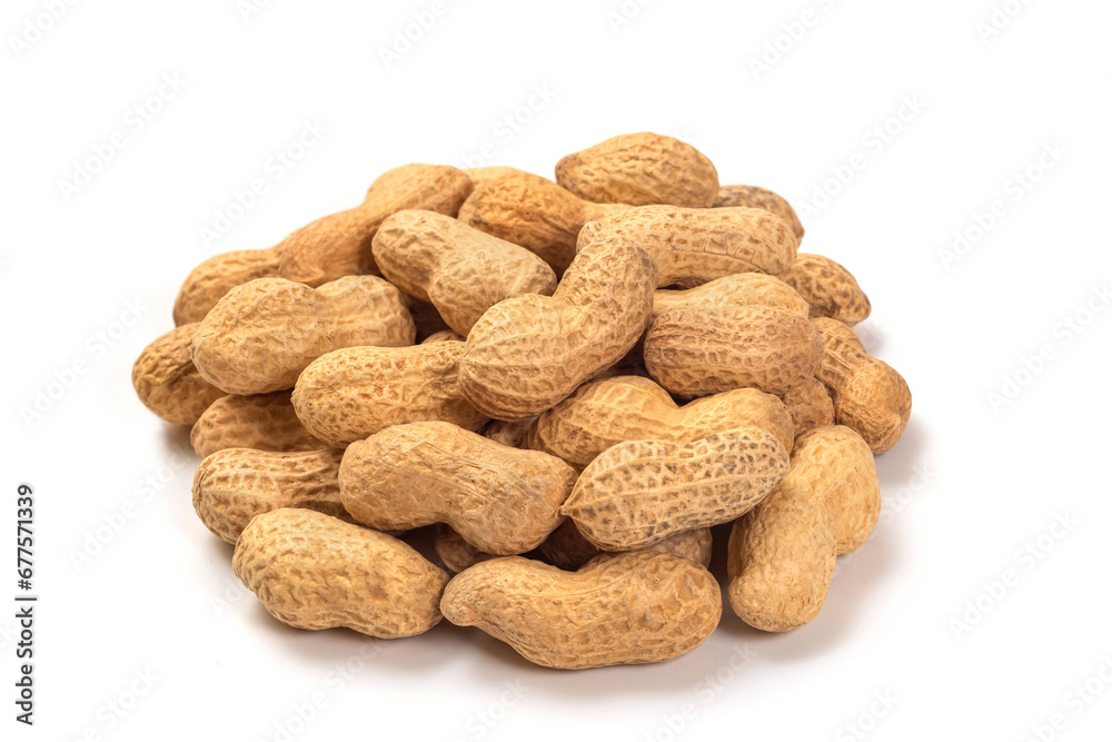 Peanuts in shell isolated on white background. Pile of peanuts close up Peanuts in shell isolated on white background. Pile of peanuts close up