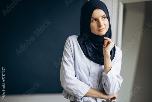 Young muslim woman wearing headscarf photo