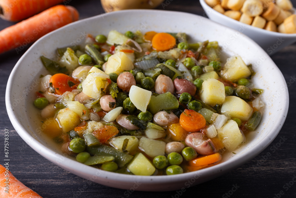 Vegetable and legume minestrone served with croutons. Complete vegan dish ideal for lunch and dinner. Italian minestrone.