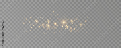 Golden sequins glow with many lights. Glittering dust. Luxurious background of golden particles.	