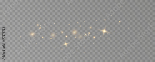 Golden sequins glow with many lights. Glittering dust. Luxurious background of golden particles.	