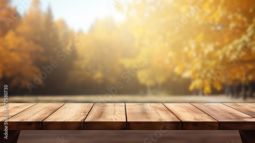empty wooden table for product presentation with a blurred autumn landscape in the background