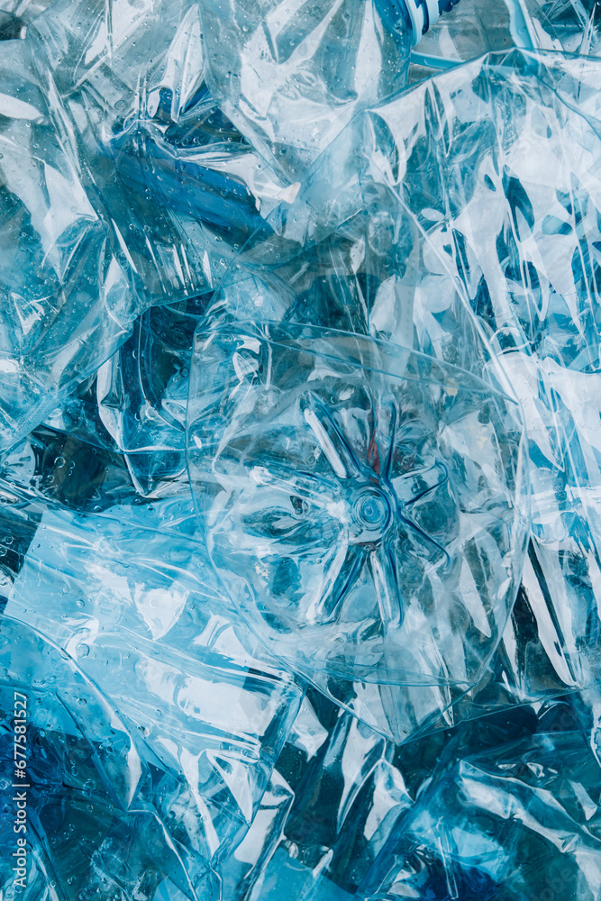 Top view of empty rumpled used blue plastic bottles background Top view of empty rumpled used blue plastic bottles background
