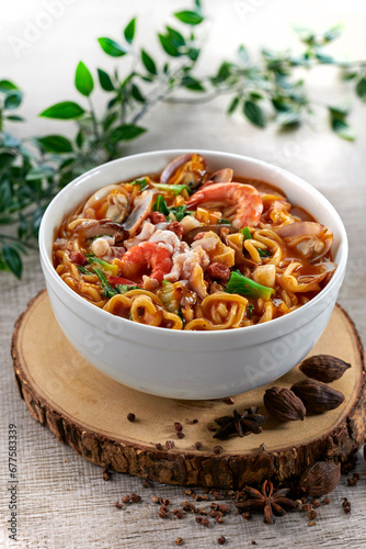 traditional chinese healthy braised puritan noodle with clam prawn seafood spicy tom yum thick soup in bowl on grey vintage background cafe hotel luxury halal food restaurant banquet menu